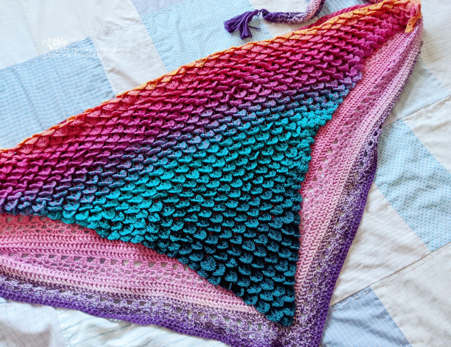 Crocodile scale scarf on top of stripe effect shawl.