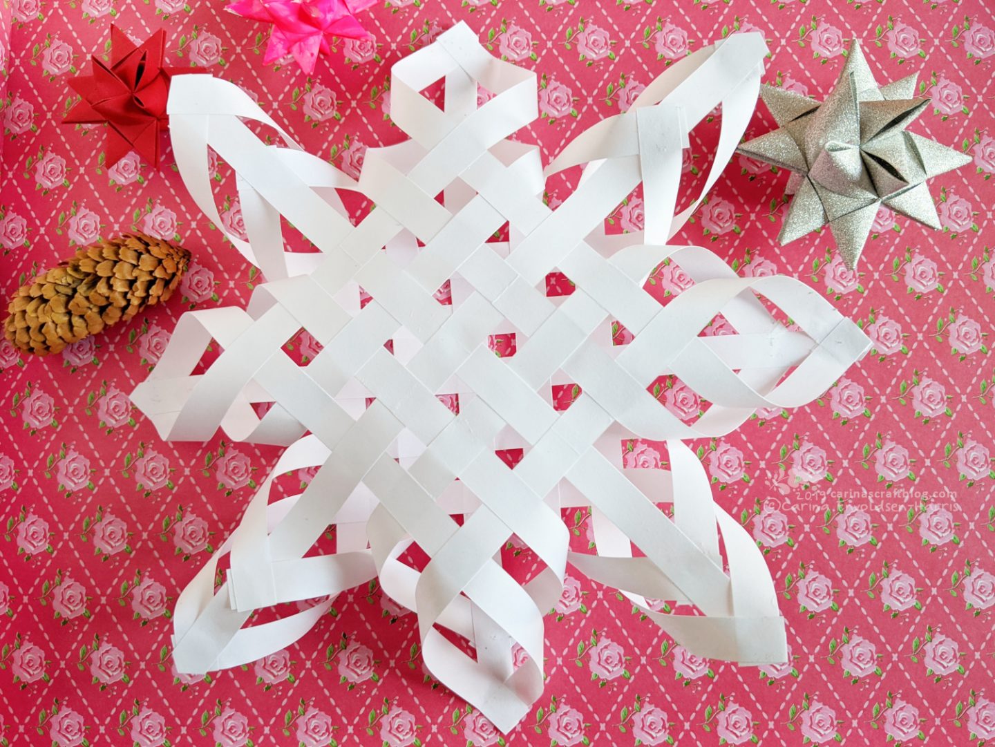 Woven paper star Christmas tree topper.