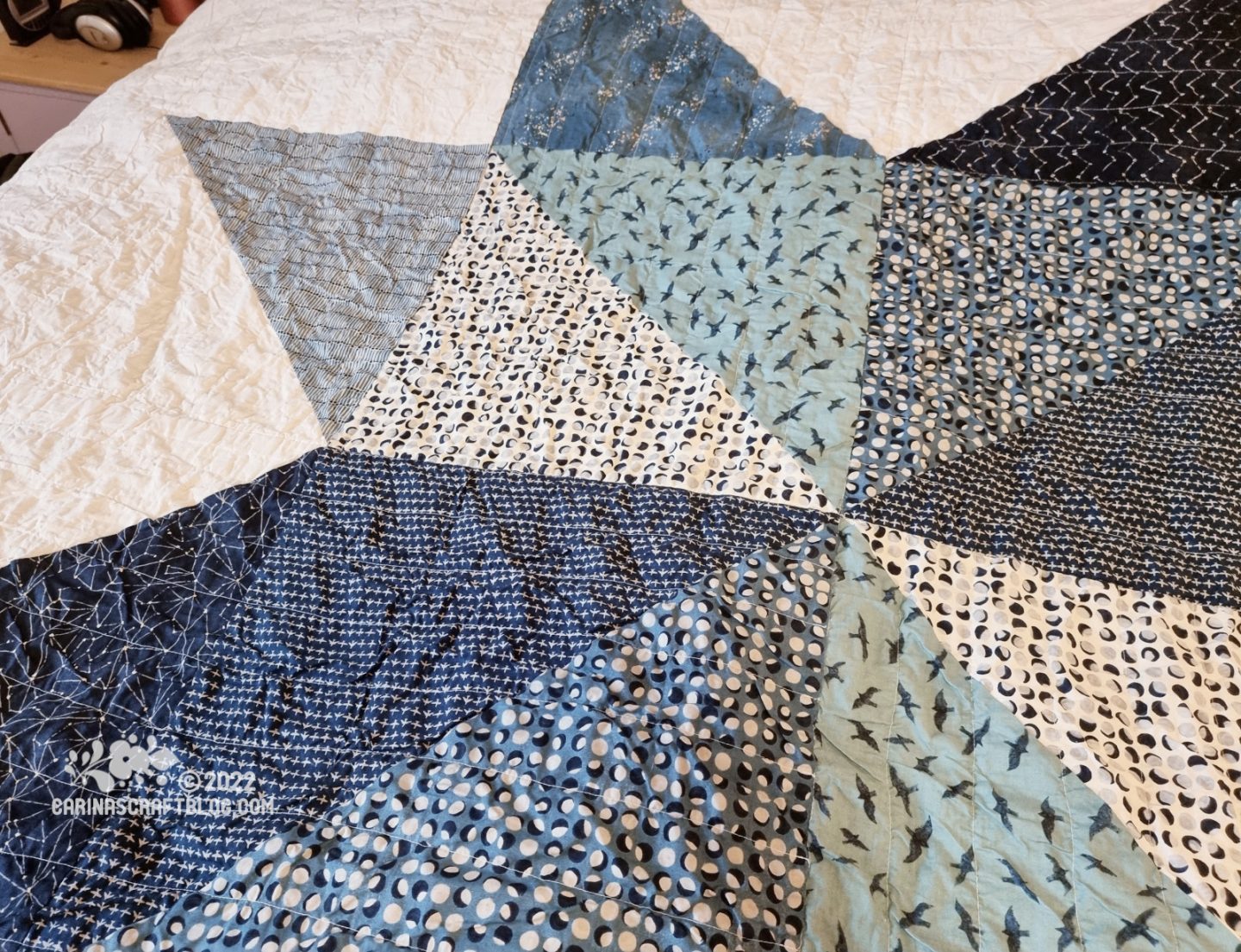Close view of star shaped giant patchwork in blue fabrics.