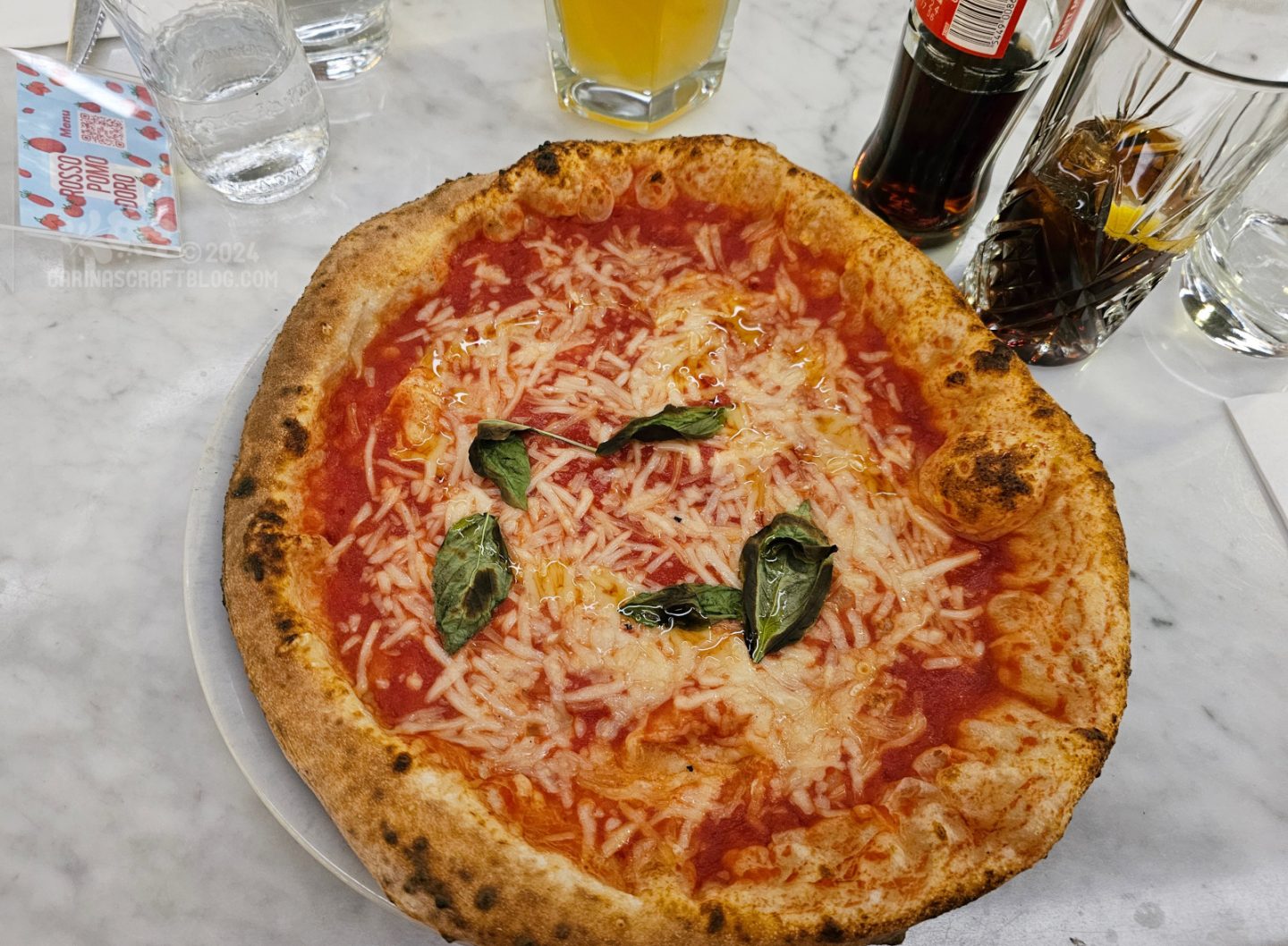 Overhead view of a margarita pizza.